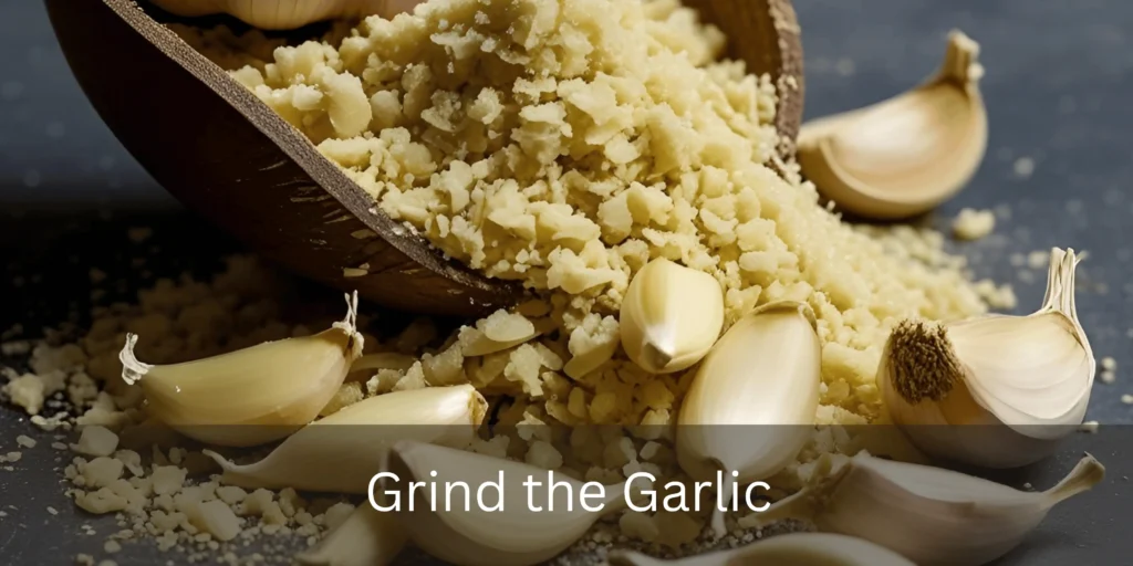 Grinding dried garlic cloves into fine powder